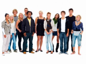 Group of smiling friends standing against white background