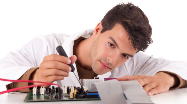 Computer Hardware Technician Fixing a Computer